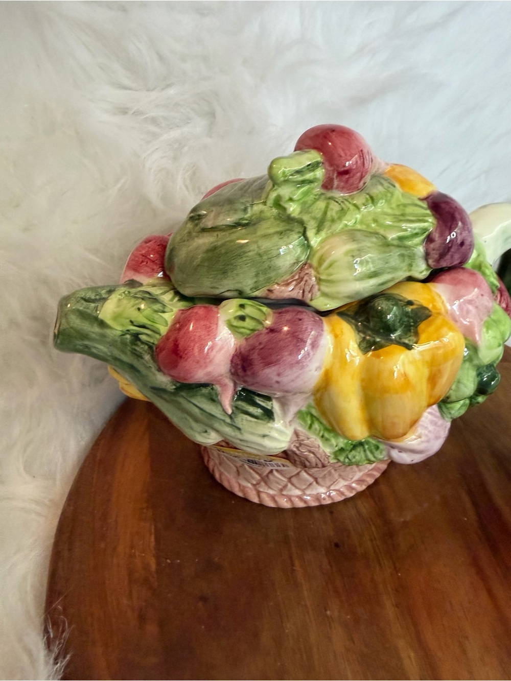 A vintage ceramic teapot and mug set shaped like a vegetable basket.